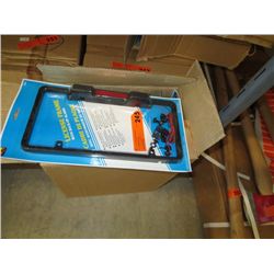 Case of license plate frames with back up alarms