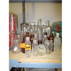 Shelf lot of glass bottles and jars