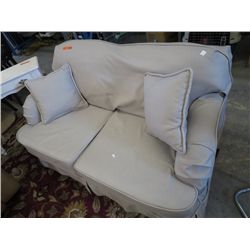 Slip covered love seat