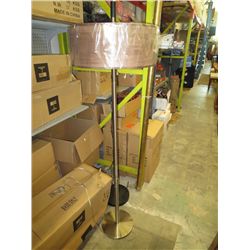 Floor lamp with brown drum shade