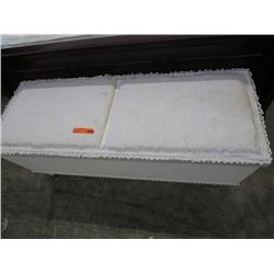Wide fabric covered storage bench on casters