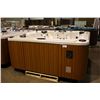 Image 1 : CAL SPAS 8' HOT TUB WITH WHITE PEARLESCENT INTERIOR AND TEAK EXTERIOR. COMES WITH: 64 JETS,