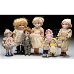LOT OF EIGHT GERMAN SMALL BISQUE DOLLS.