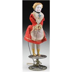 GERMAN TOP TOY WITH DANCING DOLL.