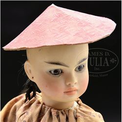 GERMAN BISQUE PORTRAIT DOLL OF ASIAN CHILD.