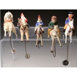 FIVE GERMAN PAPIER MACHE HORSES WITH RIDERS BALANCE TOYS.