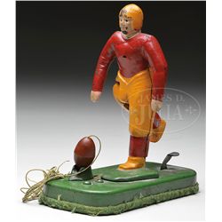 CAST IRON MECHANICAL FOOTBALL PLAYER TOY.