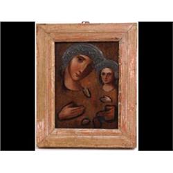 A 19th Century Icon, The Madonna and Child, with embossed silver  coloured metal mounts, on panel...