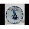 Image 1 : An Early 18th Century Delft Plate, the shallow bowl and rim decorated  in underglaze blue and man...