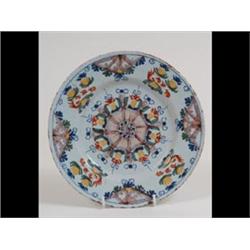 An 18th Century Delft Polychrome Plate, with floral style decoration,  some fritting, cracked, 22...