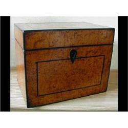 A Victorian Birds Eye Maple Tea Caddy, with ebony stringing, 16cm £50-80...