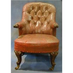 A William IV Mahogany framed library chair upholstered red buttoned back hide and raised on Frenc...