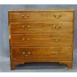 A Georgian mahogany chest of 4 long drawers inlaid satinwood with original brass swan neck handle...
