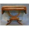 Image 1 : A Regency mahogany sofa table with crossbanded top, fitted a frieze drawer and raised on a U shap...