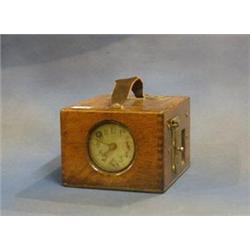 A racing pigeon clock contained in an oak case £30-50...