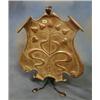 Image 1 : An Art Nouveau embossed copper and wrought iron fire screen of shield shape embossed flower heads...