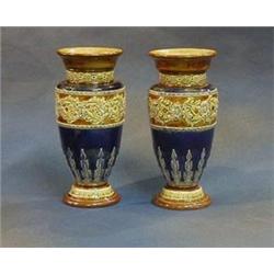 A pair of Royal Doulton salt glazed club shaped vases, the bases impressed Royal Doulton 1706 and...