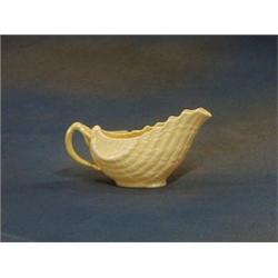 A Beleek porcelain sauce boat, the base with green mark and RD No. 0857 7" £30-50...