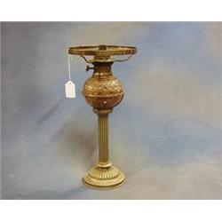 A cut glass oil lamp reservoir raised on a silver plated reeded column by Hewkin & Heath £30-50...