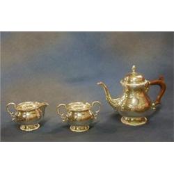 A Georgian style 3 piece silver tea service of baluster form with gadrooned borders, comprising t...