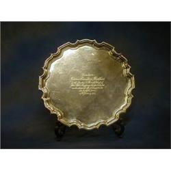 A silver salver with bracketed border, raised on 3 scrolled supports, inscribed, Sheffield 1924,...