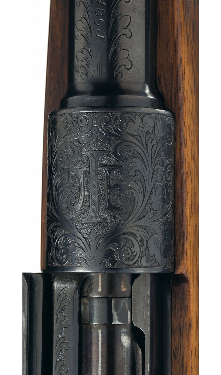Engraved Mauser Bolt Action Rifle with Carved Stock and Scope