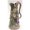 Image 1 : A 'solid agate' stoneware jug, probably German, moulded and enamelled with grapes and vine leaves...