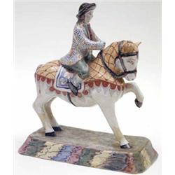 A 19th century Delftware figure of a man on horseback, painted in polychrome, 9.5ins (restored) £...