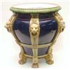 Image 1 : A Minton majolica jardiniere with 6 lion mask mounts, against a dark blue ground, on claw feet, (...