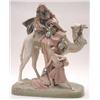 Image 1 : A Royal Dux camel and rider group with a boy holding carpet bags below, on a naturalistic base, N...