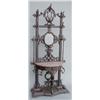 Image 1 : A Victorian cast iron demi lune hall stand, with central oval mirror, and rouge marble top over c...