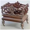 Image 1 : An early Victorian rosewood Canterbury with foliate scroll carved divisions and base drawer, on t...