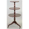 Image 1 : A George III mahogany dumb waiter with 3 dished circular tiers and slender baluster stem, on down...