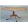 Image 1 : A Regency cross banded mahogany breakfast table with rounded rectangular tilt top and ring turned...