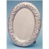 Image 1 : A Victorian oval silver toilet mirror embossed and chased with flowers and scrolls, 14ins. makers...