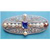 Image 1 : A French white gold Edwardian design pierced work oval plaque brooch set with a central cushion s...