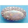 Image 1 : A large elliptical oval opal brooch bordered by 20 brilliant cut diamonds. (see illustration) £35...