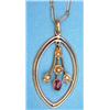 Image 1 : An Edwardian 9ct gold pendant of open navette shape and central amethyst and seed pearl floral dr...