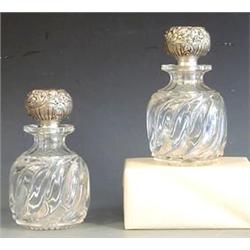 PAIR OF STERLING SILVER AND GLASS DECANTERS American. Date mark on silver 1892. Maker: Gorham. Ea...