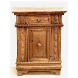 RENAISSANCE WALNUT CREDENZA Italian. 16th/17th Century. The rectangular top with chip carved mold...