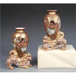 PAIR OF SATSUMA FIGURAL POTTERY VASES Japanese. Late Meiji Period. Signed. Each modeled as a shi-...