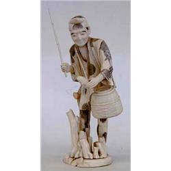 CARVED IVORY FIGURE OF A FISHERMAN Chinese. 20th Century. Walking among tree trunks with a straw...