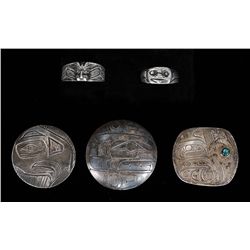 Three Northwest Coast Silver Pendants with Incised Design 1 3/8" W. and Two Northwest Coast Silver R