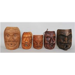 Four Coast Salish Tsonoqua Masks 9 1/2" H. - 11 1/2" H.  All in Good Condition and a Portrait Mask T