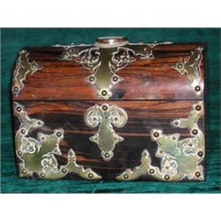 A good Victorian brass mounted coromandel dome top box, the hinged lid inset...