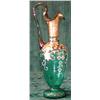 Image 1 : A green glass ewer with gilt and floral painted decoration...