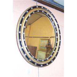 19th Century Irish oval mirror, the black and gilt frame decorated with glass cabochons, 1'11" x...