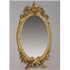 Image 1 : 19th Century oval wall mirror within a gilt gesso frame decorated with bell husks, the floral des...
