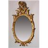 Image 1 : George III oval wall mirror within a carved wood and gilt gesso frame having eagle surmount, 3'6"...