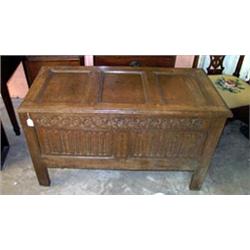 17th Century oak coffer having a triple fielded panelled lid, rosette design carved frieze, the t...